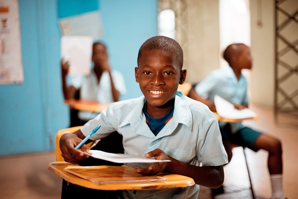 Photo by Ben White on Unsplash, African Boy at school