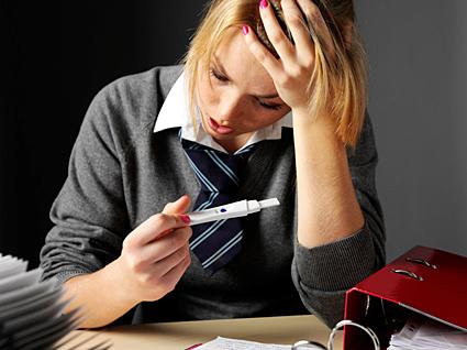 Teenager holding pregnancy test